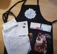 Apron, 5x7in Pouch, Tote Bag, A5 Stickersheet, 4x6in Recipe Cards, 2x6in Bookmark, 40mm Wooden Pin.